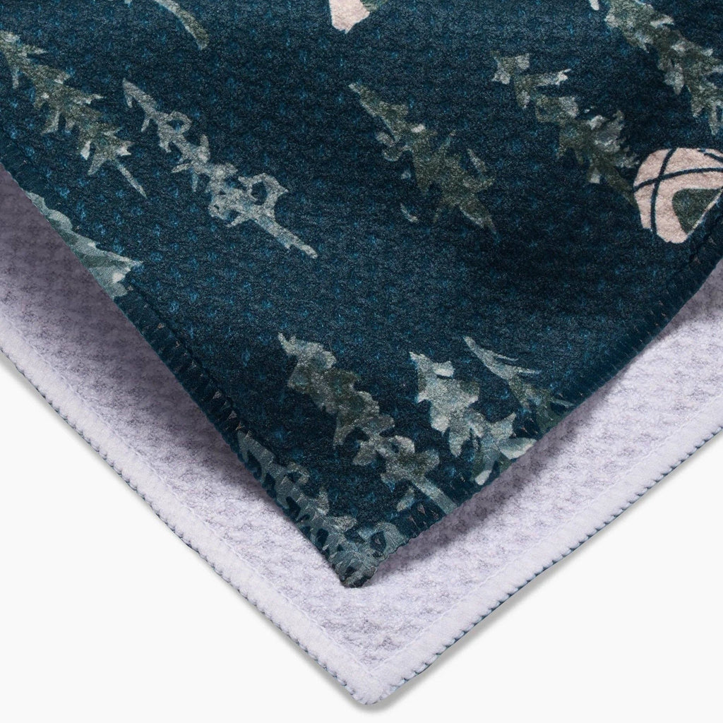 blue/green tent in forest design tea towel