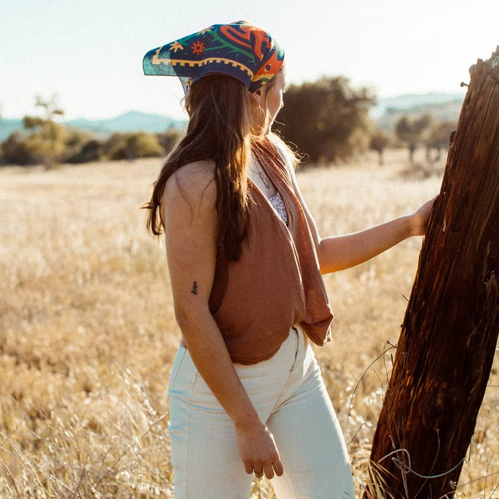 With "Endless Bloom," Lauren showcases her irreverent yet playful style with a colorful interpretation of the dichotomy of femininity, the cyclicality of life, and the natural beauty in the areas between. Her design takes cues from wildlife and traditional designs found in the Southwestern US to create mindful, wearable homage to the Southwestern landscape.