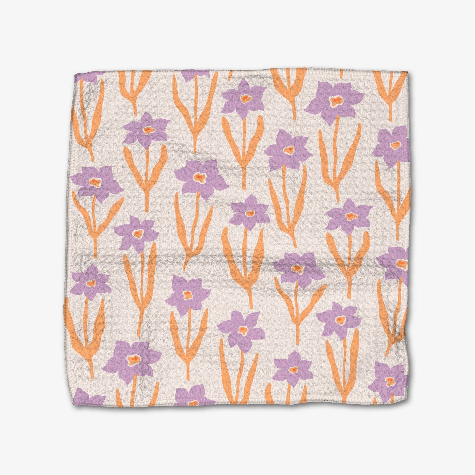 Floral patterned fabric with purple and orange flowers on a white background