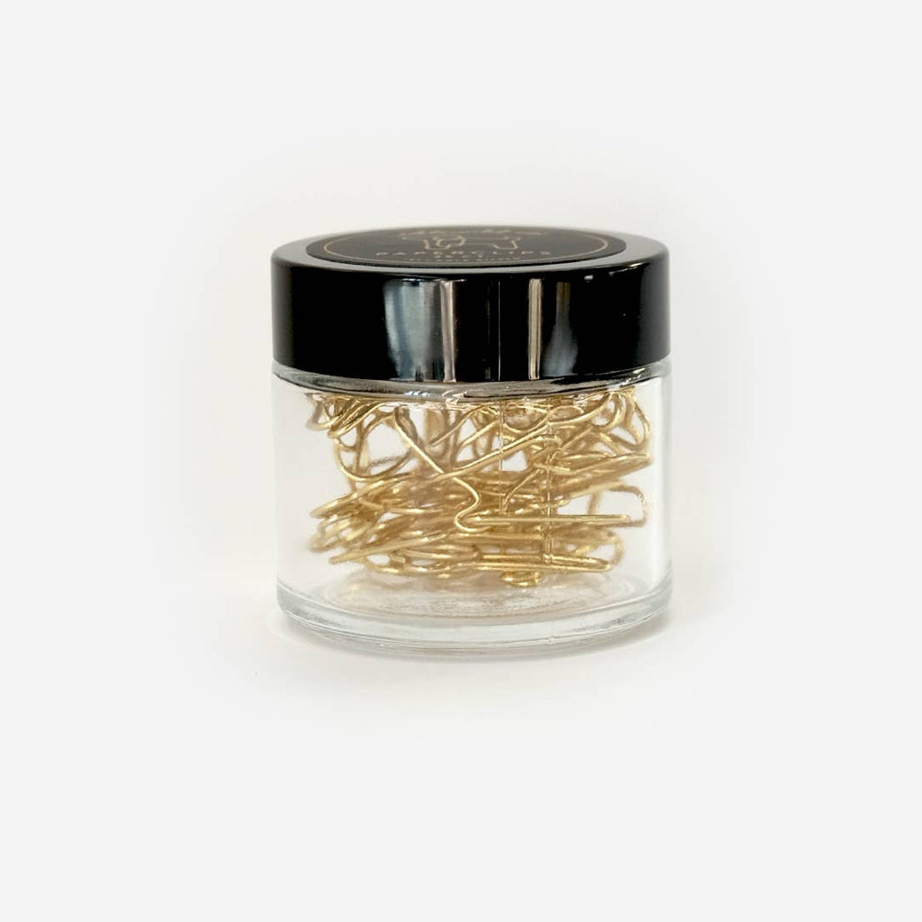 Our fun and quirky paper clips make all of your office &amp; school work just a bit more–if not exciting–than at least more aesthetically pleasing.

Small glass jars are filled with 25 puppy shaped, 10k gold clips to dress up your desk, homework, bills, planners–anything you can think of!

• Glass Jar of 25-pieces

• Clips approximately .75" x 1"