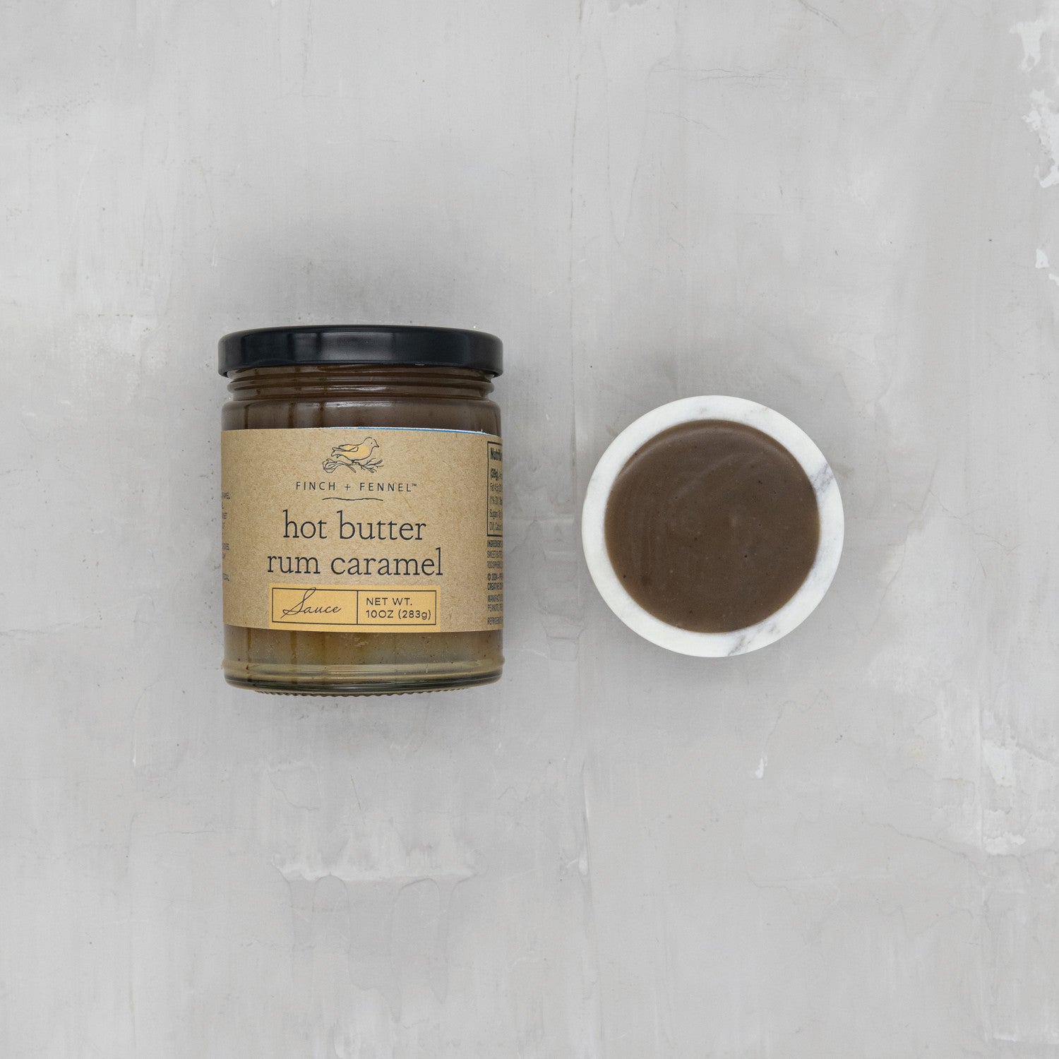 Indulge in the rich, comforting flavor of our 10 oz. Hot Butter Rum Caramel Sauce. This decadent sauce features notes of dark rum, creamy butter, and caramelized sugar, creating a warm and inviting treat perfect for drizzling over ice cream, pancakes, or enjoying straight from the spoon.