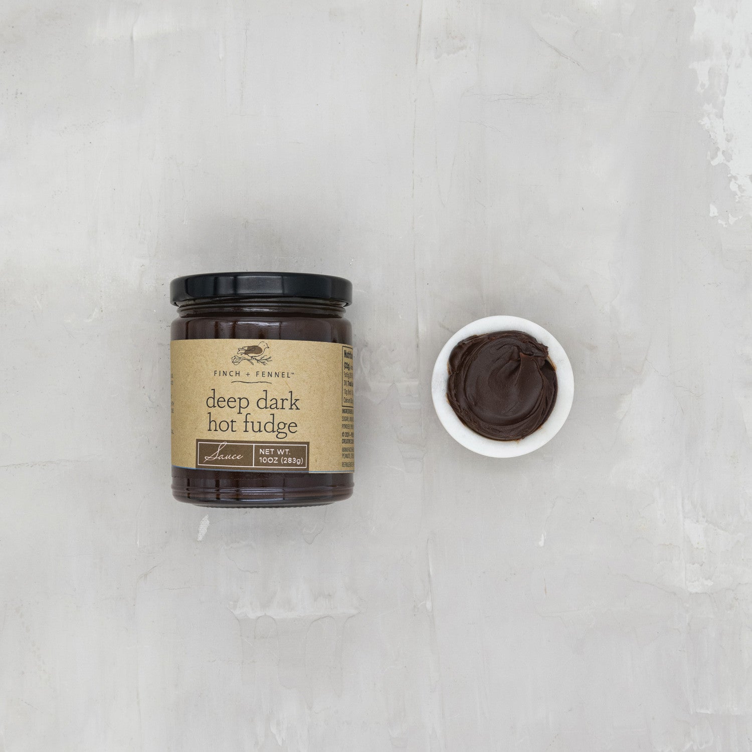 Indulge in the decadent richness of our 10 oz. Deep Dark Hot Fudge Sauce. Made with premium cocoa for an intensely chocolatey flavor, this sauce is the perfect topping for ice cream, brownies, or simply enjoyed by the spoonful. Heat gently for a luxurious, warm treat.