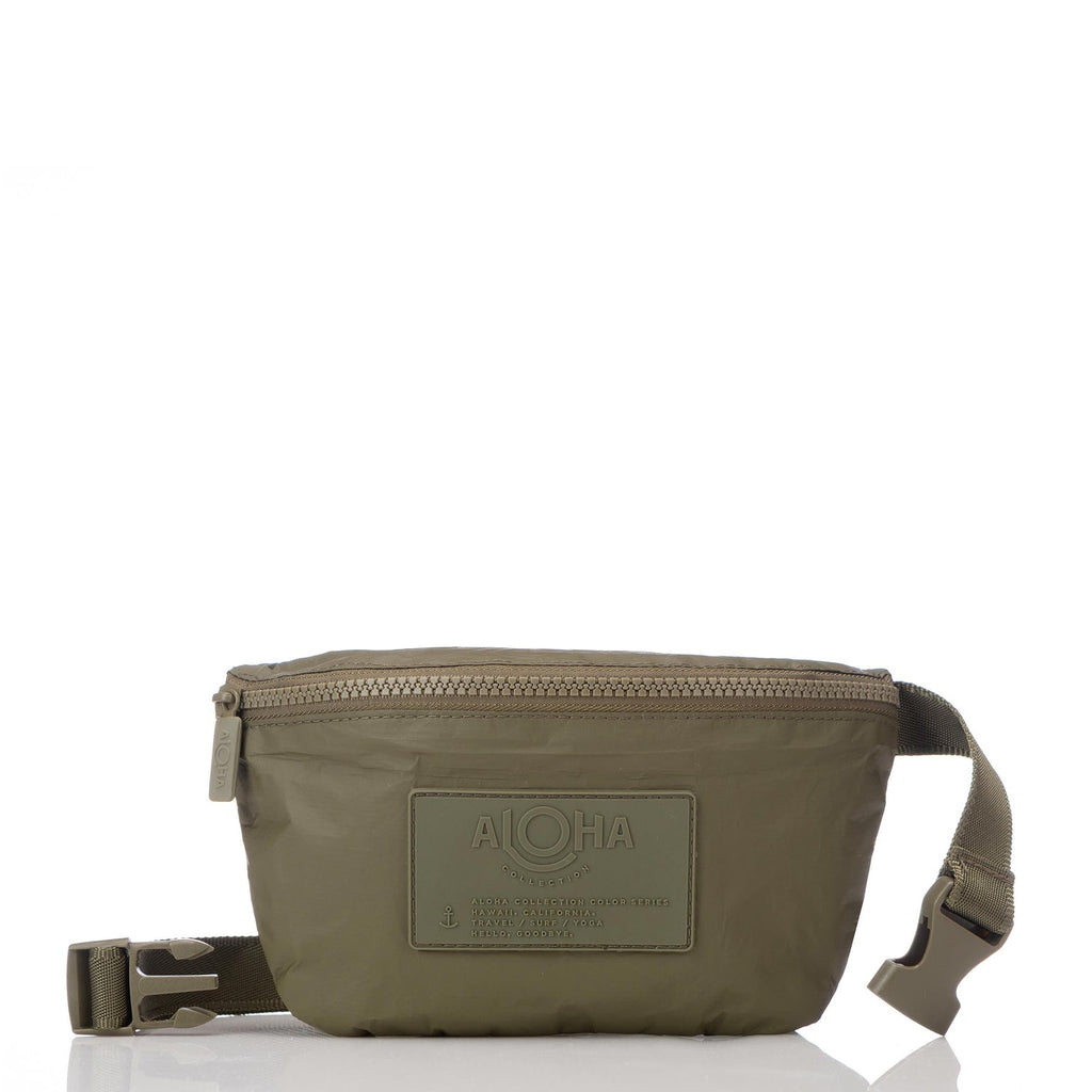 Whether you want to carry a snack, pack your phone, or speed through TSA, this olive color hip pack helps you do it all hands-free. Store your cash, credit cards, and hotel keys in a handy inside zipper pocket and easily access your ID or passport during air travel or train transit. It's great for traveling, hiking, biking, and everyday adventures. With its versatile design, you can wear it as a crossbody bag or around your waist.