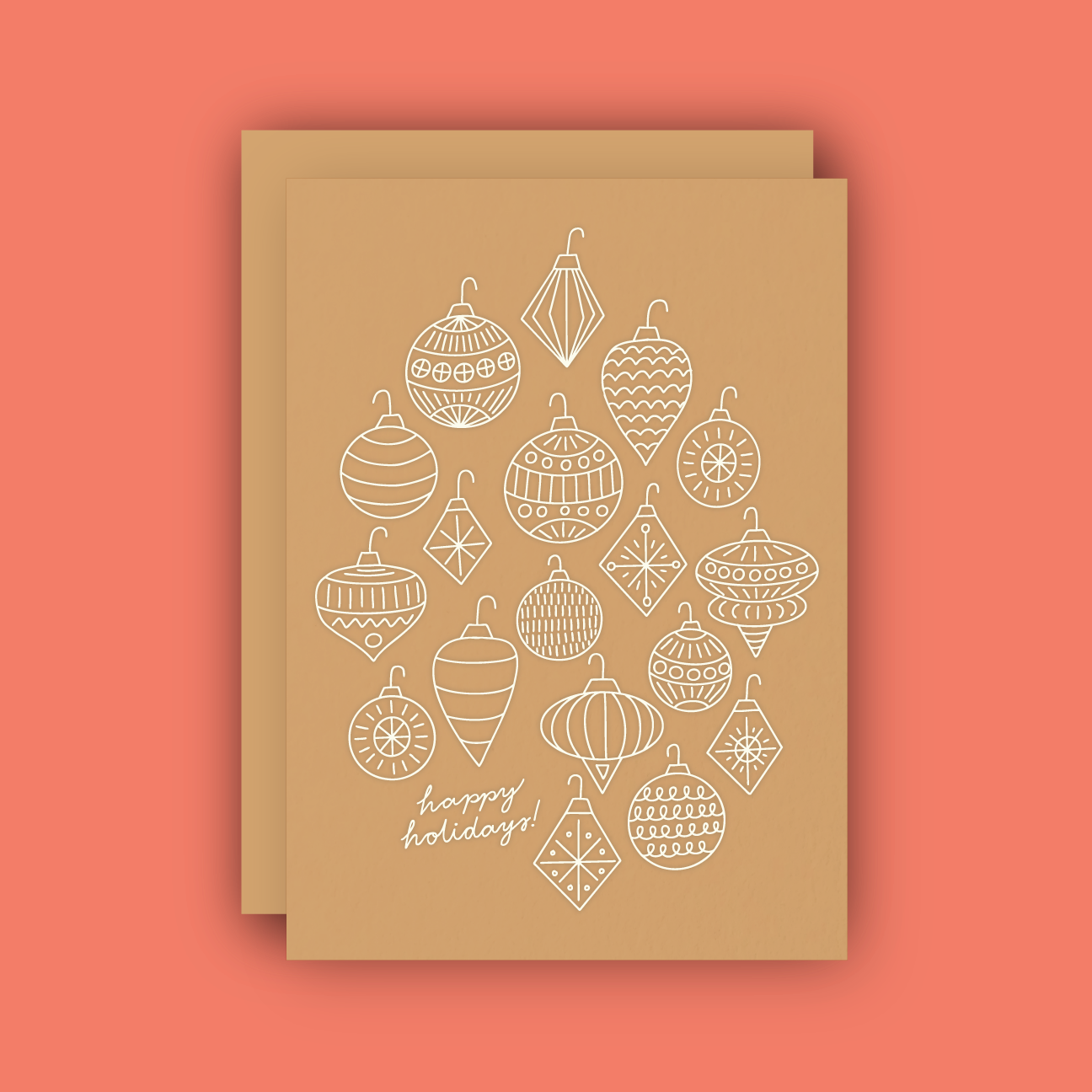 A holiday card adorned with ornaments in white foil on brown kraft paper. 