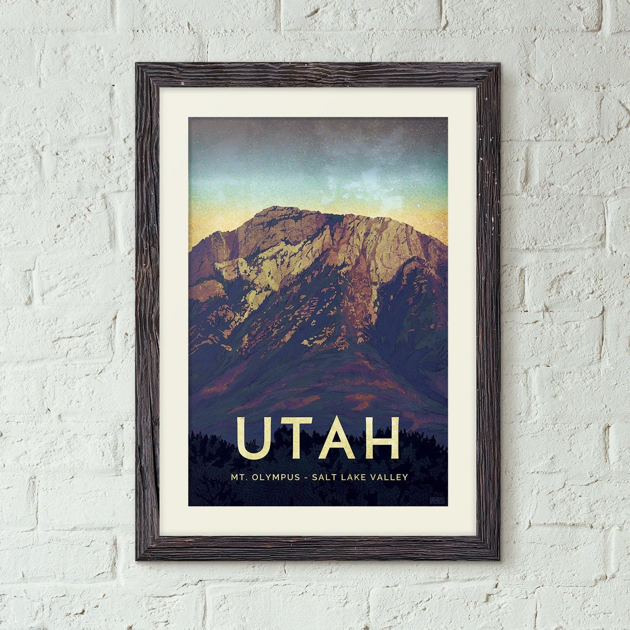 poster of a mountain landscape with 'Utah' text on a white brick wall.