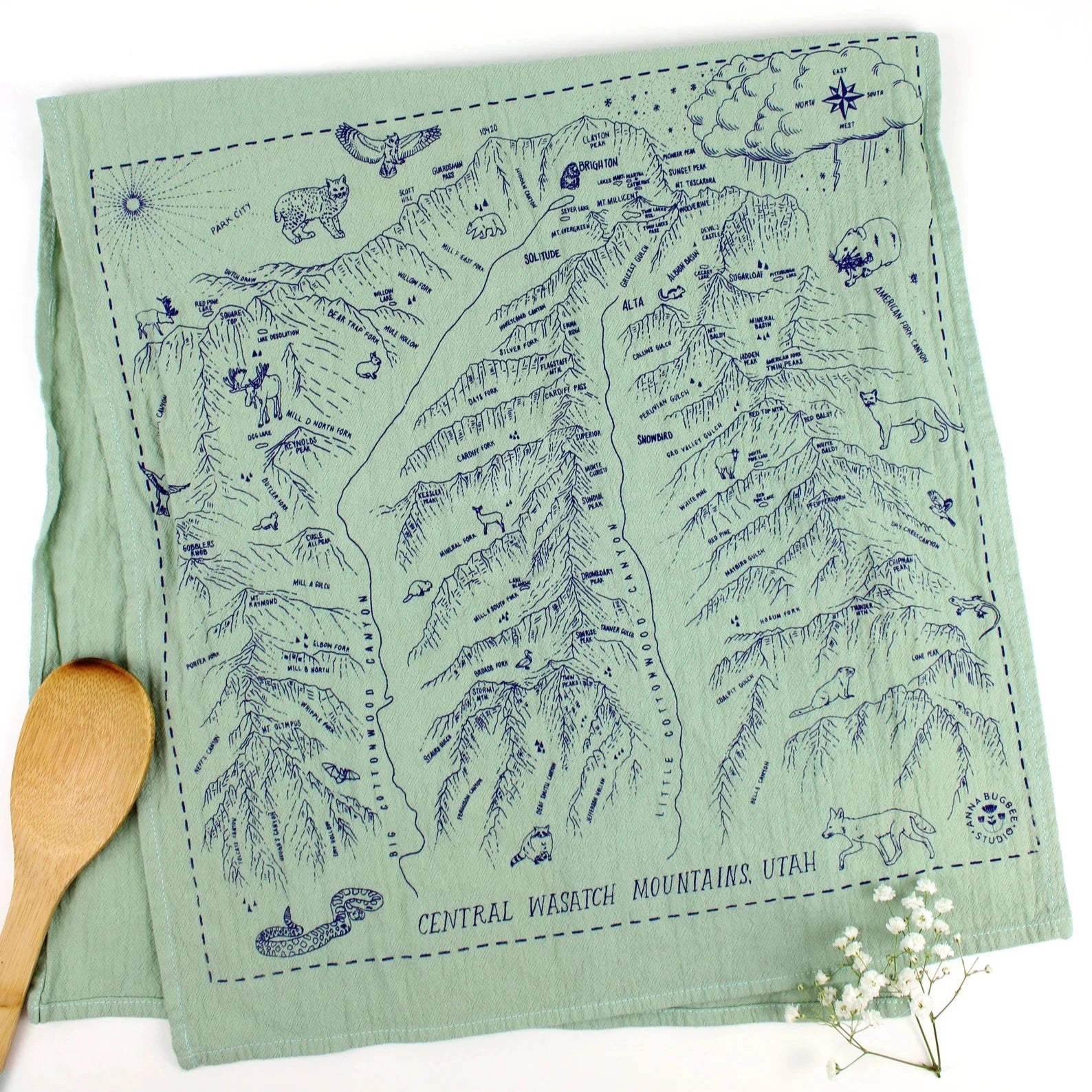 Green screen printed tea towel featuring a map of big and little cottonwood canyons