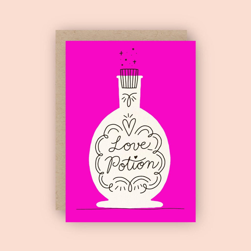 Pink card with white "Love Potion" bottle illustration 