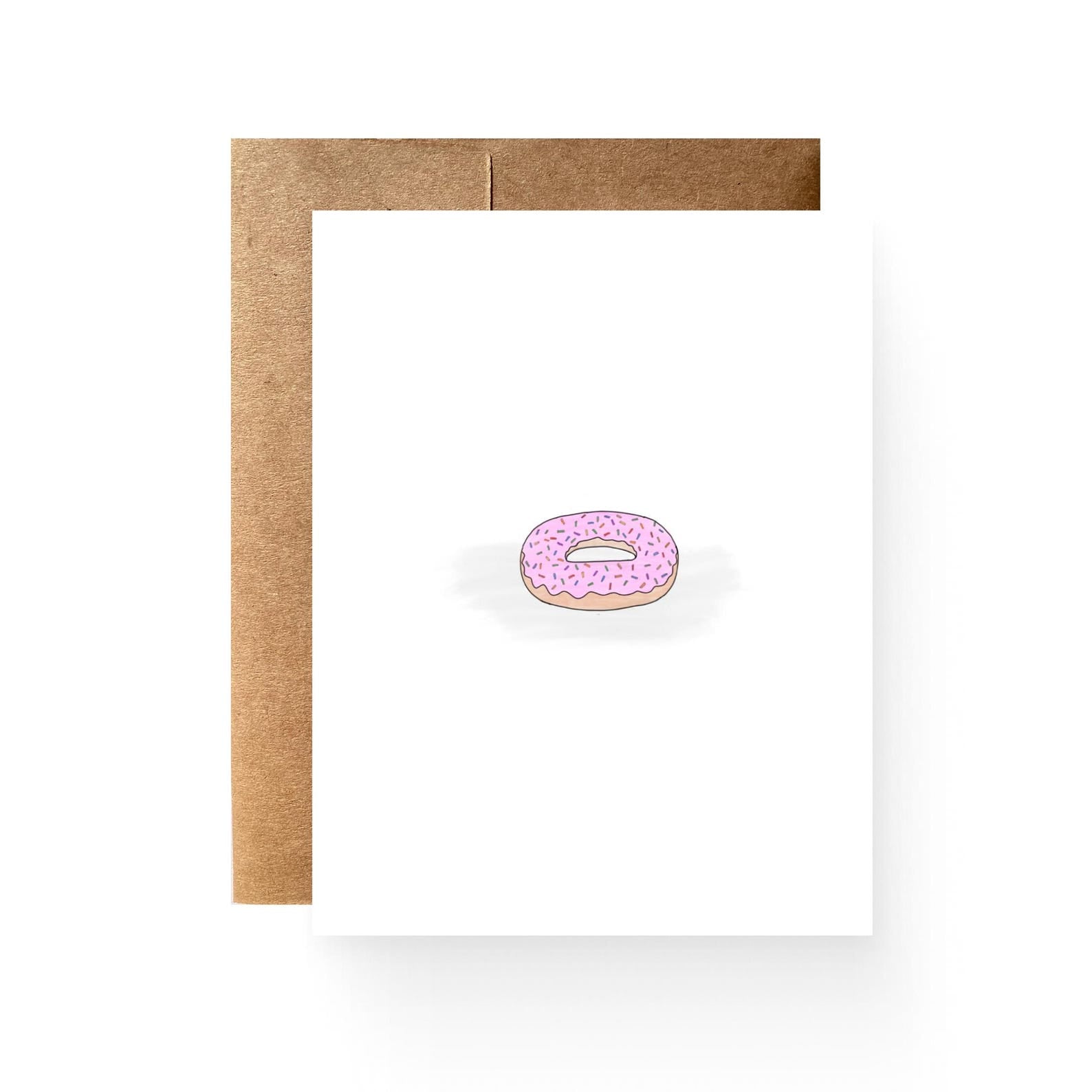 white card with an illustration of a pink sprinkled donut