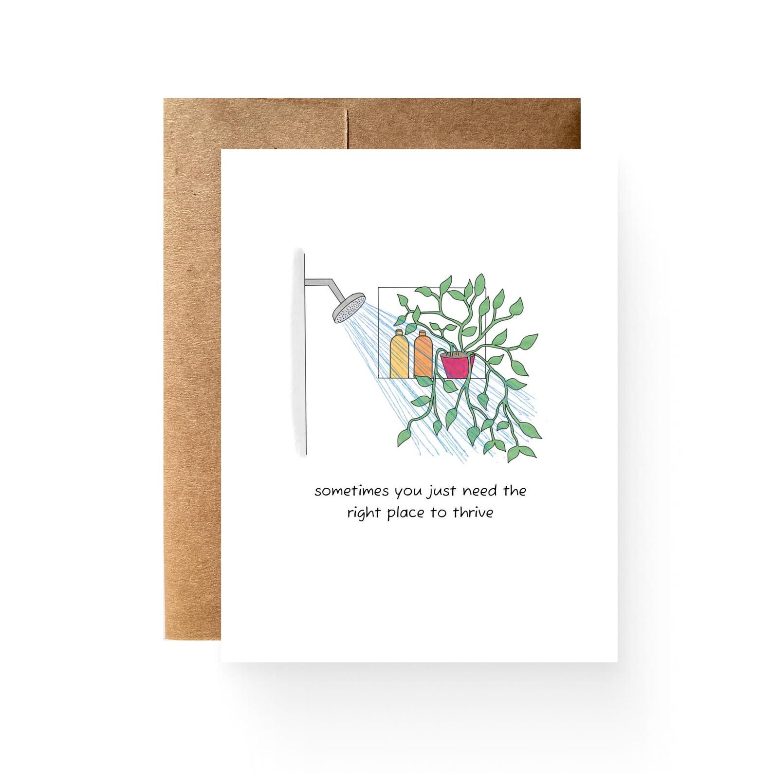 white card featuring a shower full of plants reading "sometimes you just need the ight place to thrive"