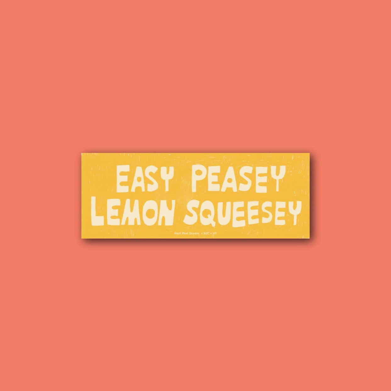 Yellow bumper sticker reading "easy peasey lemon squeesey"
