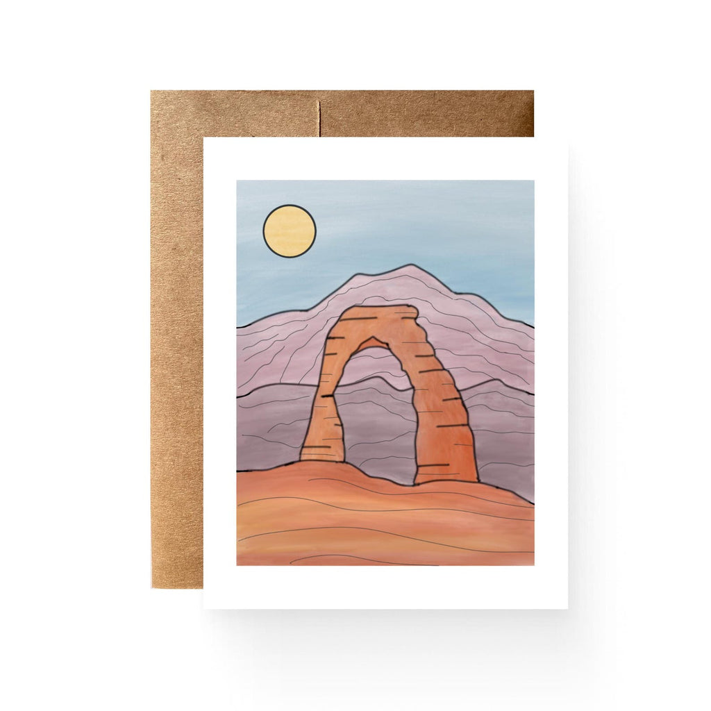 white card with an illustration of delicate arch with mountains and a sun