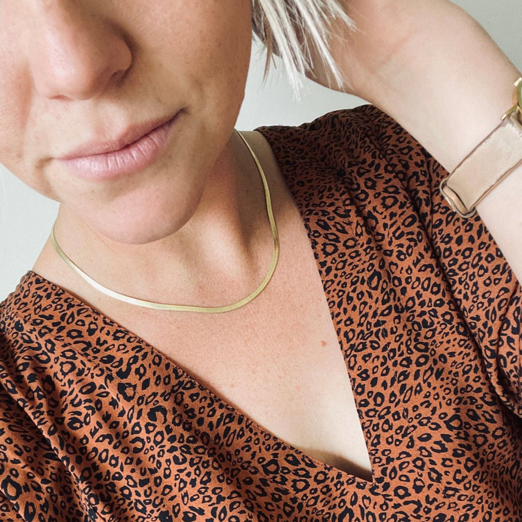14k gold filled chain over stainless steel. Hypoallergenic, will not tarnish, will not irritate skin. Available in 3 mm (Skinny Brene) or 4 mm (Brene). Available in 15.5-17.5" length (Has a two inch extender on the back) or 17.5-19.5"