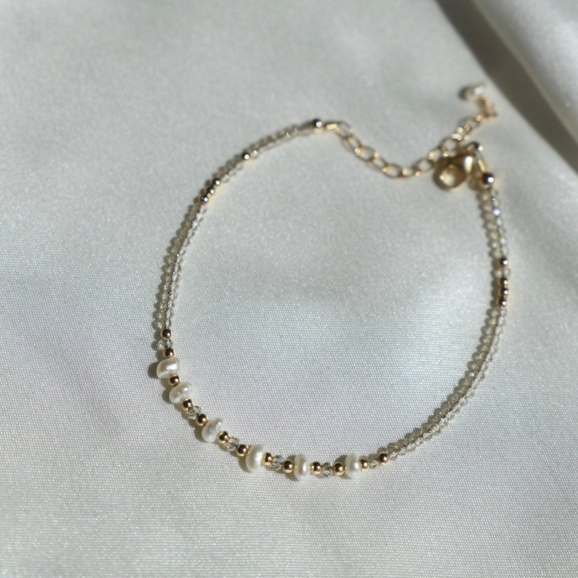 Be the belle of the beach with the Golden Sands Bracelet! A summery accessory made with sand-colored crystals and gold-filled and freshwater pearl beaded accents, this bracelet is just what you need to spruce up your look.