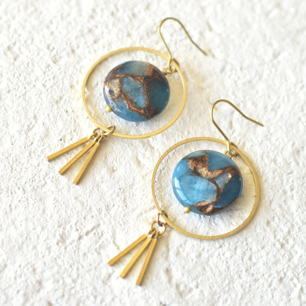 Dreamy earrings made fit for a goddess. These Brass Dangle Hoop Earrings centered around oh so stunning Blue Golden Aqua Quartz stones with a radiant sun burst charm detail. Earring hang 2.25" from top to bottom on nickle free earring hooks.