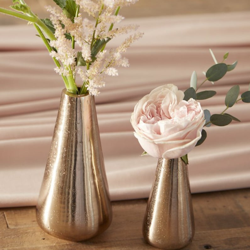 "Add some melody to your home decor with Lyric Budvase. Available in 2 sizes, these vases are perfect for showcasing your favorite blooms (or pens, or makeup brushes - we won't judge). Tune up your home with these charming, versatile vases."