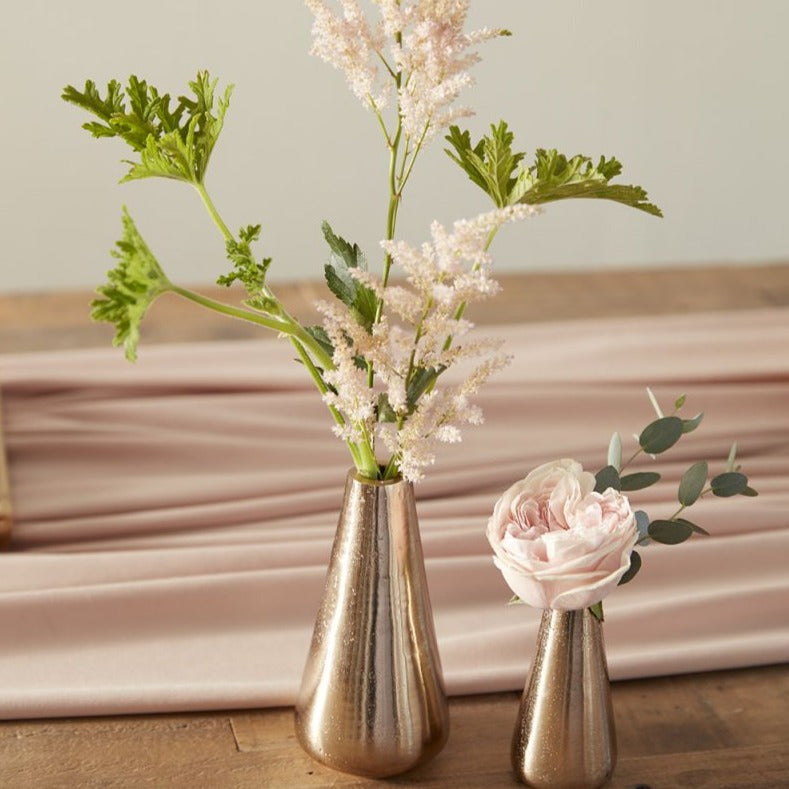 "Add some melody to your home decor with Lyric Budvase. Available in 2 sizes, these vases are perfect for showcasing your favorite blooms (or pens, or makeup brushes - we won't judge). Tune up your home with these charming, versatile vases."