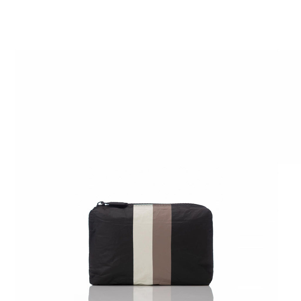Meet the Mini pouch in Caffe/Black. Don't let its small size fool you—this pouch can be used in a million ways to keep life's little moments organized. Traveling by air? Curate your own inflight kit to keep essentials like a sleep mask, earplugs, face serum, and sanitizer spray in one convenient place. Put it to use as a coin purse or small wallet to store keys, credit cards, cash, and IDs to keep your bags clutter-free.