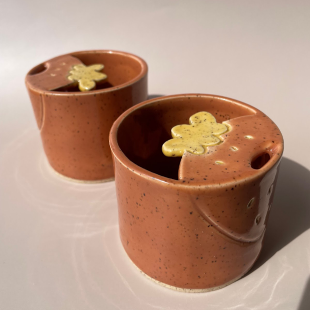 orange sipper travel mugs with strawberry details