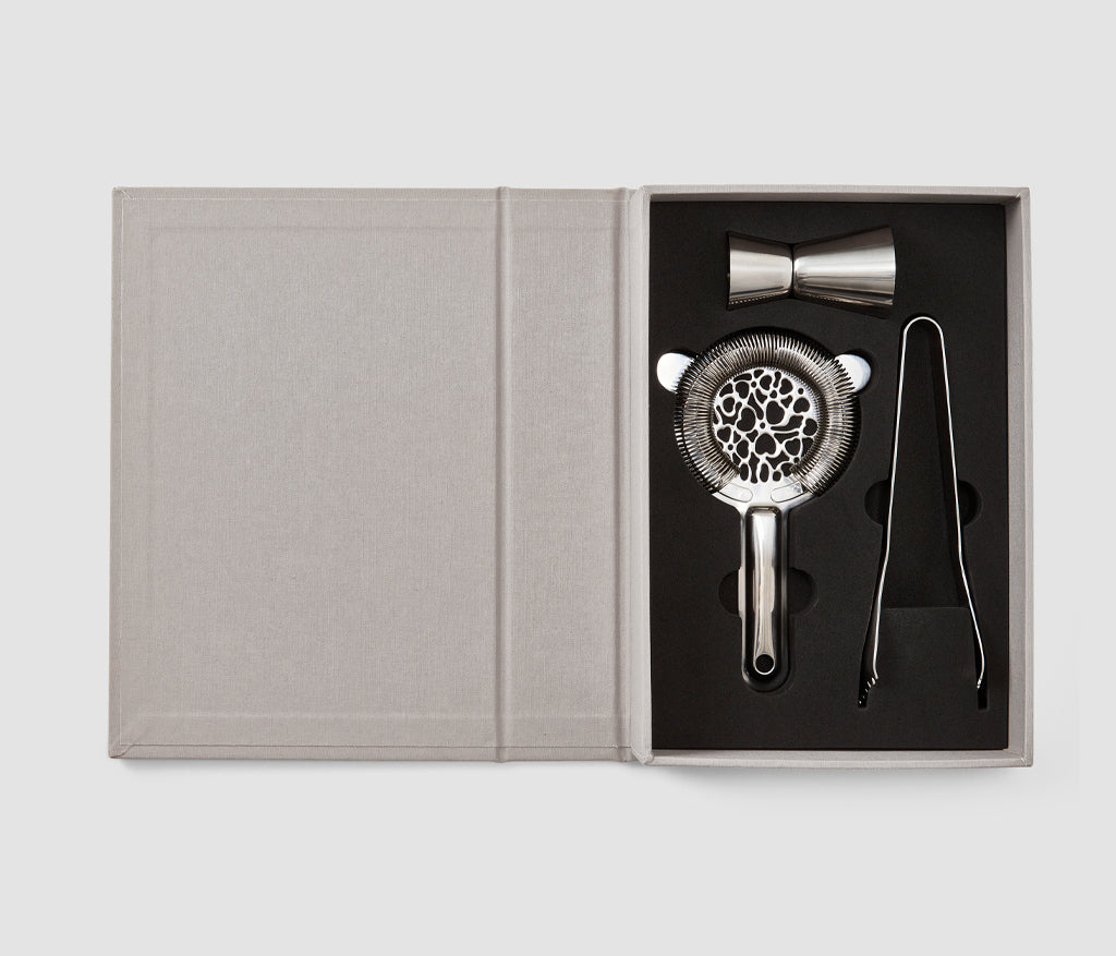Introducing the essential kit for creating the most refreshing cocktails - a refined toolbox in an elegant book-like box. Inside, you'll find an ice thong, a Hawthorne strainer, and a jigger, each serving as essential tools in the world of mixology to ensure the creation of a well-crafted and balanced drink.