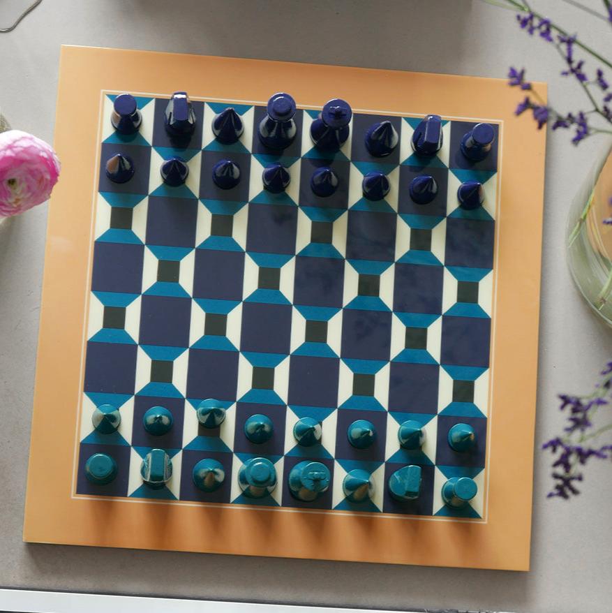 Discover our unique edition, "Chess Clouds", featuring a spectacular design inspired by the sky. The pieces and board are made of wood, with a thin layer of acrylic mounted on the board's surface, creating an impressive reflection. The box is crafted from high-quality art paper, adorned with a printed cloud formation, and enhanced with a hot foil print in navy and white.