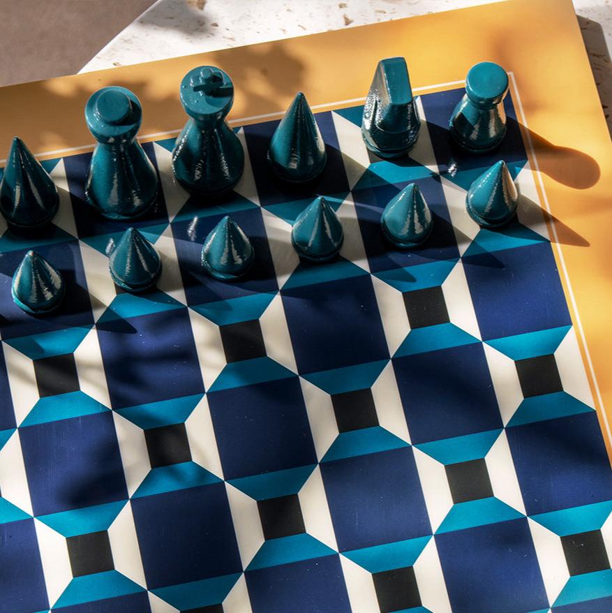 Discover our unique edition, "Chess Clouds", featuring a spectacular design inspired by the sky. The pieces and board are made of wood, with a thin layer of acrylic mounted on the board's surface, creating an impressive reflection. The box is crafted from high-quality art paper, adorned with a printed cloud formation, and enhanced with a hot foil print in navy and white.