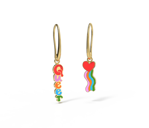 Show your pride with your earrings—one of these earrings reads "queer" and the other features a heart with a rainbow. Both earrings cause joy and smiles. Wear one on each ear, or combine them on a double ear piercing!  Presented in a matchbook style gold foil box, our signature mismatched earrings feature 18k gold gilt enamel on hanging earwire. Hypoallergenic, nickel, lead, and cadmium-free!&nbsp;