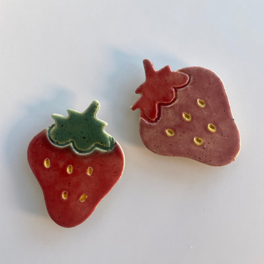 pink and red ceramic strawberry magnets