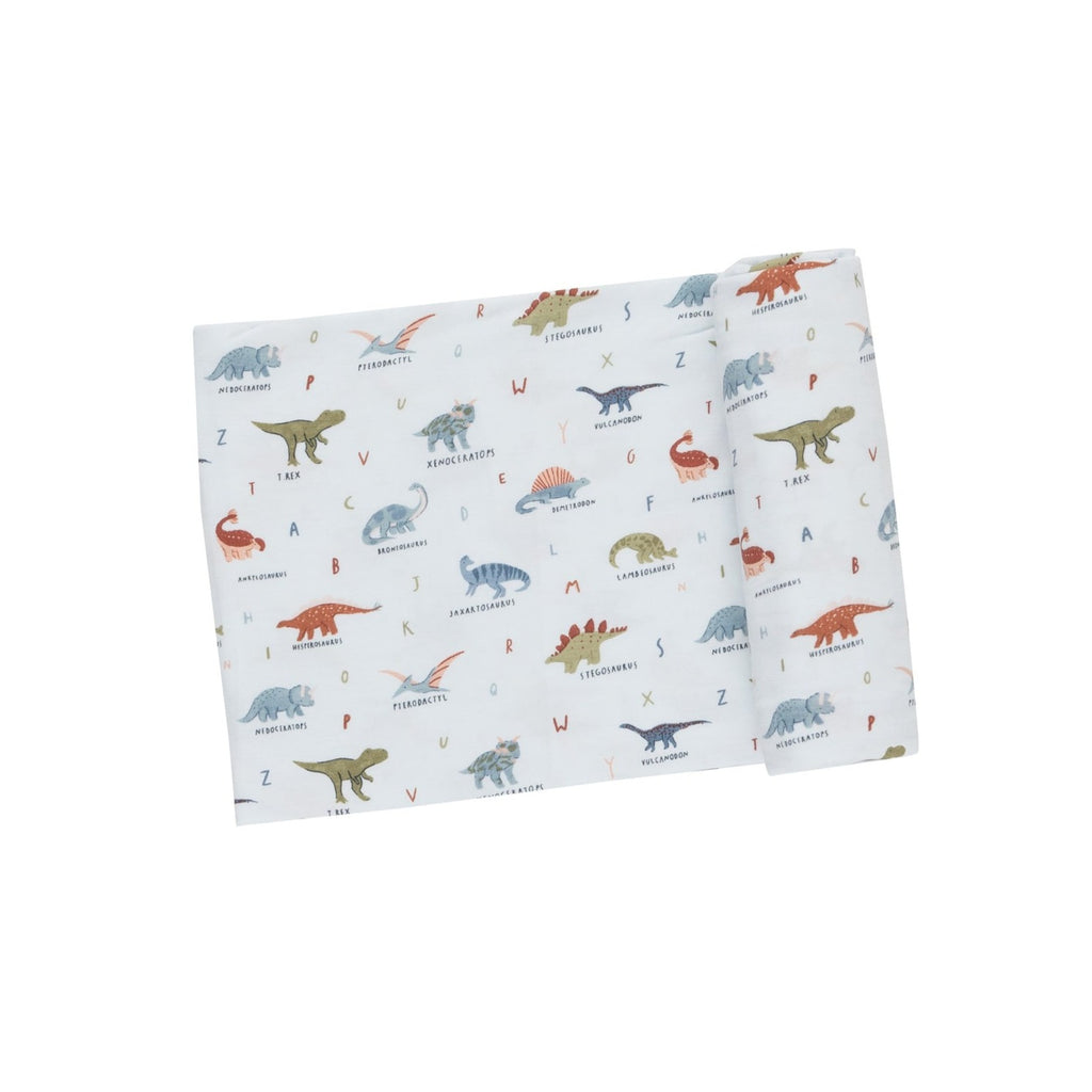 Snuggle, Swaddle, Sleep, Repeat. Our soft and adorable print swaddles are sure to delight everyone! A versatile design that's great for swaddling, nursing, cuddling and so much more. Dinosaur ABC