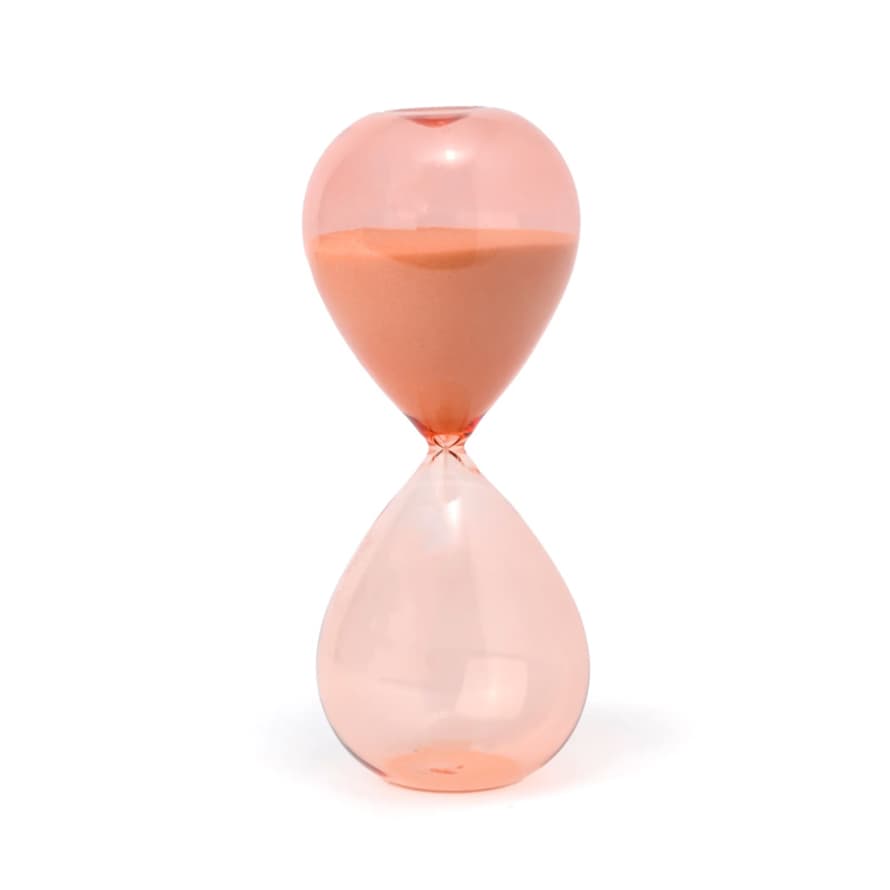 Beautiful peach glass hourglass with peachy-pink sand