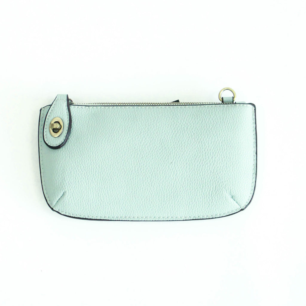 The Uptown Messenger Purse is perfection in a handbag! This versatile piece can be used as an adjustable cross-body bag, wristlet, or a simple wallet, making it the perfect finishing touch to any night out. A zippered top and rotating clasp closure are timeless elements that will make this the most functional purse you'll ever own!