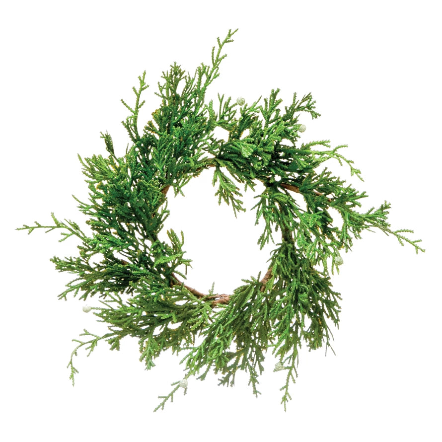 This wreath is a great first impression for any festive home. Made out of faux juniper, this wreath is both simple and classic. This piece effortlessly welcomes anyone entering your home in a festive way, and adds a pop of style to any door     Dimensions  4-1/2"  Round