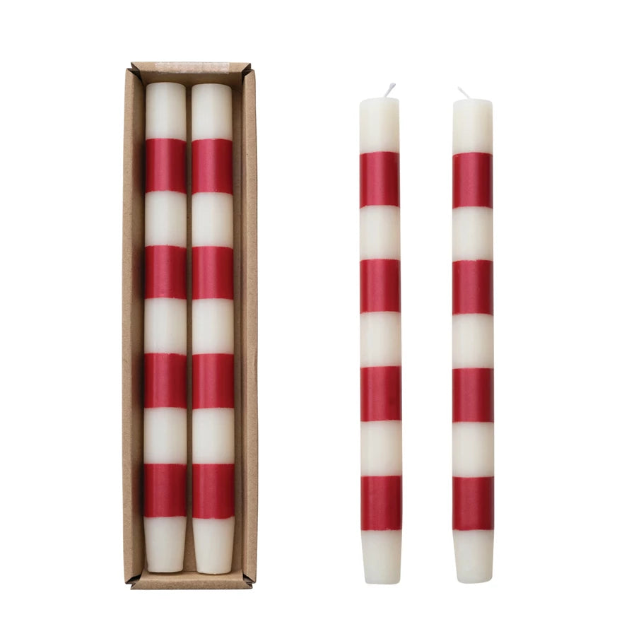 Set the mood with our Unscented Taper Candles featuring playful stripes. Includes a set of two candles in a convenient box. No need for overpowering scents, just enjoy the warm, flickering light. Perfect for any occasion, without taking itself too seriously. Red & White Striped