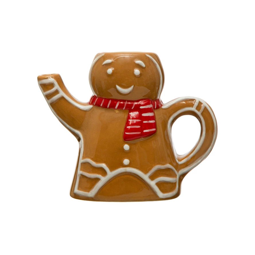 This sweet little hand-painted ceramic gingerbread man creamer is the perfect addition to your kitchen! With a colorful scarf made of delicate brushstrokes, he'll be sure to make your coffee or tea time just a bit more special. Hot cocoa, anyone? It’s totally gingerbread-approved!