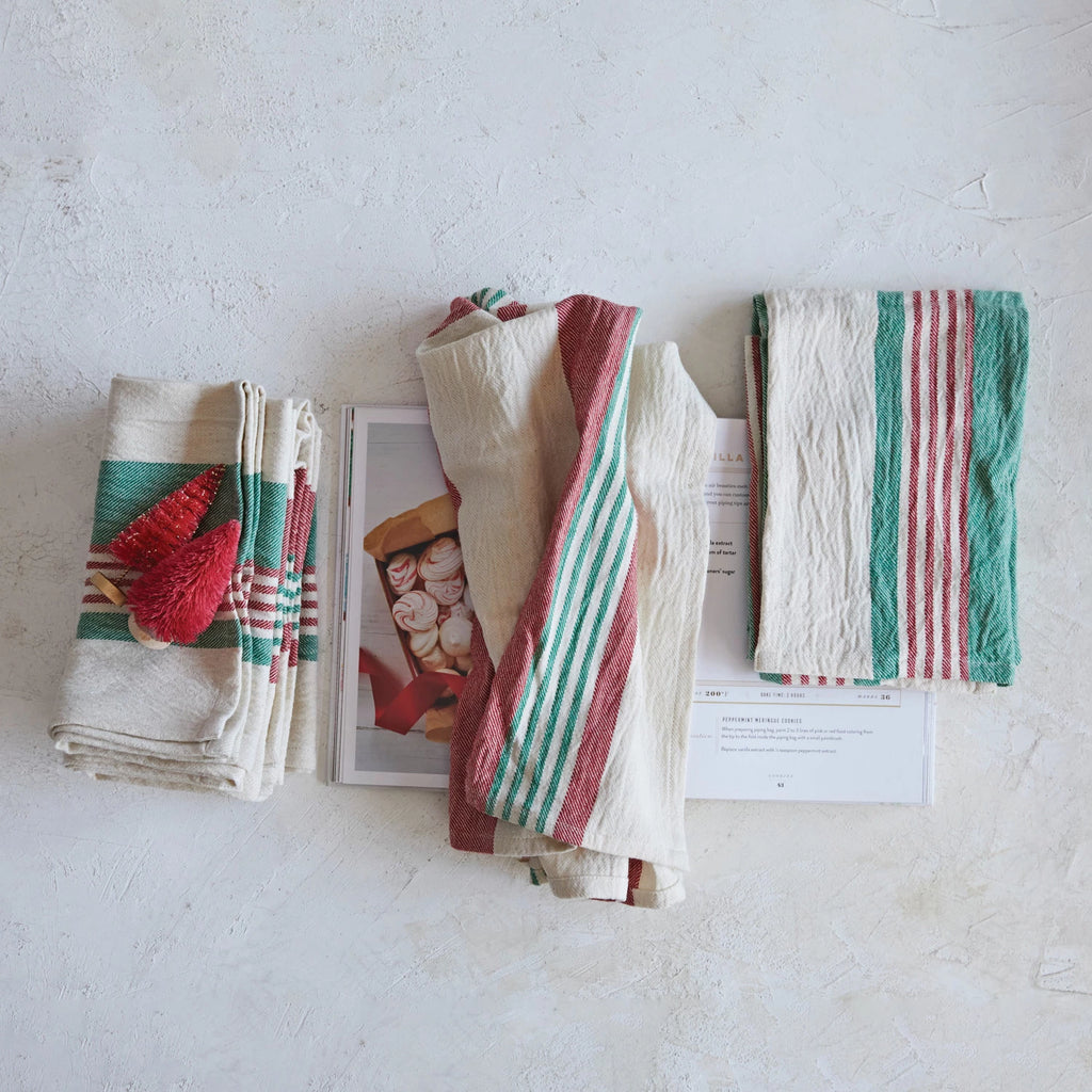 This set of Cotton Printed Tea Towels are far from ordinary! With stripes, a jute tie, and wood bead accents - it's like a party for your kitchen! Wipe away mess and dry dishes in style with these fun and functional towels!     Size  28"L x 18"W      Styles  Striped