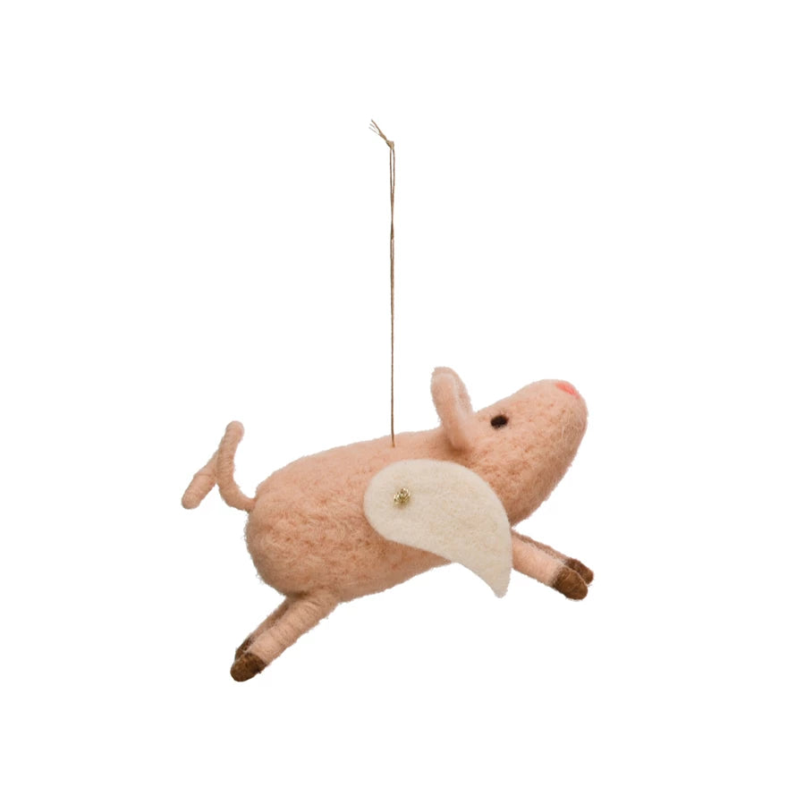 Send your holiday wishes sky-high with this delightful wool felt flying pig ornament! Crafted with a unique pink & white palette, this cute cutie will give your tree a touch of perky personality and provide plenty of 'oink'-spiration! 
