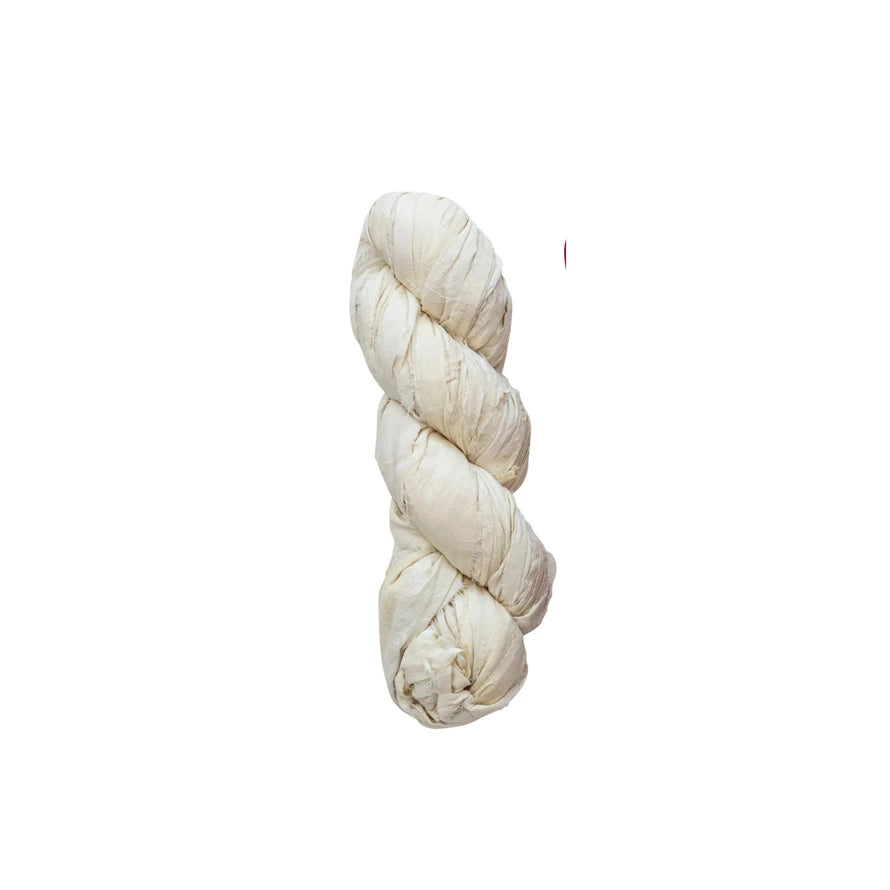 Going green never felt so glamorous! Get creative with this fancy recycled torn silk ribbon, available in chic Ivory. Perfect for adding a touch of rustic elegance to your special occasion projects. (And no need to feel guilty about it!) 70-75 yards of eco-friendly chicness, coming right up!     Color  Ivory     Material  Recycled Torn Silk Ribbon     Size  70-75 Yard