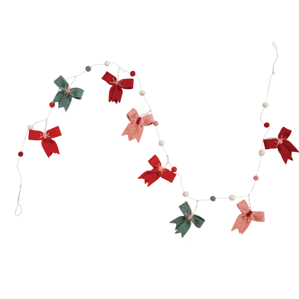 This festive Handmade Wool Felt Ball & Bow Garland will bring your holiday decorations to the next level! Get creative with the vibrant colors and stylish bows—they'll make your home a bright, inviting space for family and friends. Let's get this party started!       Size  72"L 