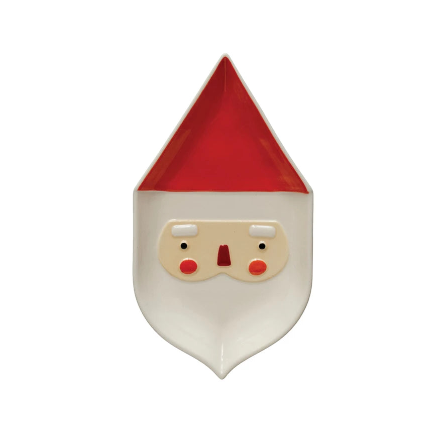 Make your holiday meals merry with this quirky Stoneware Santa Platter! Crafted with festive stoneware, this platter will be sure to spread Christmas cheer. Plus, its unique shape is sure to be the talk of the dinner table! Ho-ho-host the holiday party with ease. 9-3/4"L x 5-1/2"W 