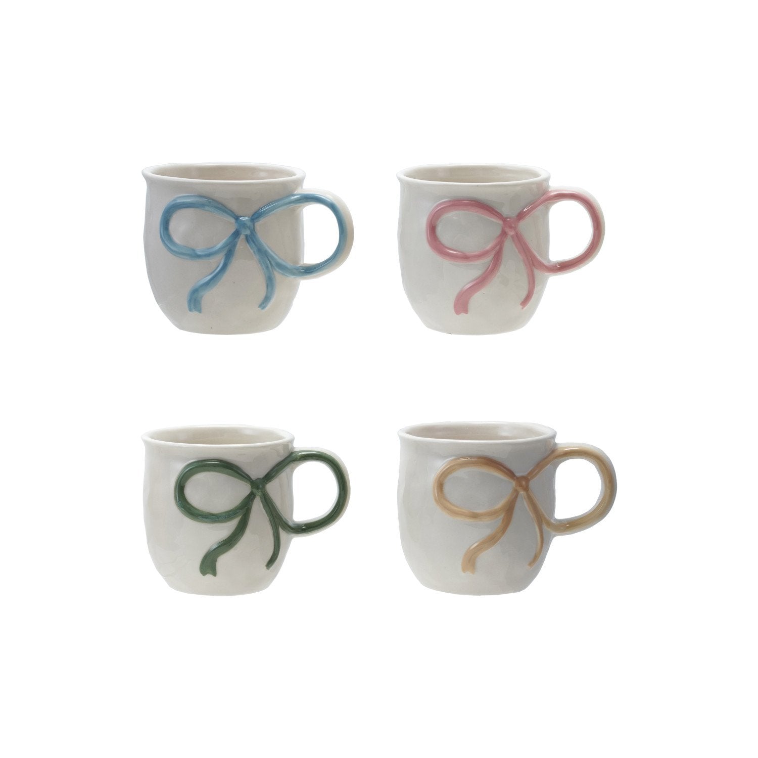 Four ceramic mugs with colorful bow designs on a white background