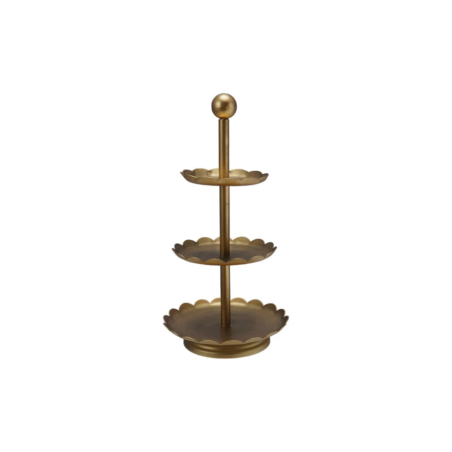 Gold three-tiered stand on a white background