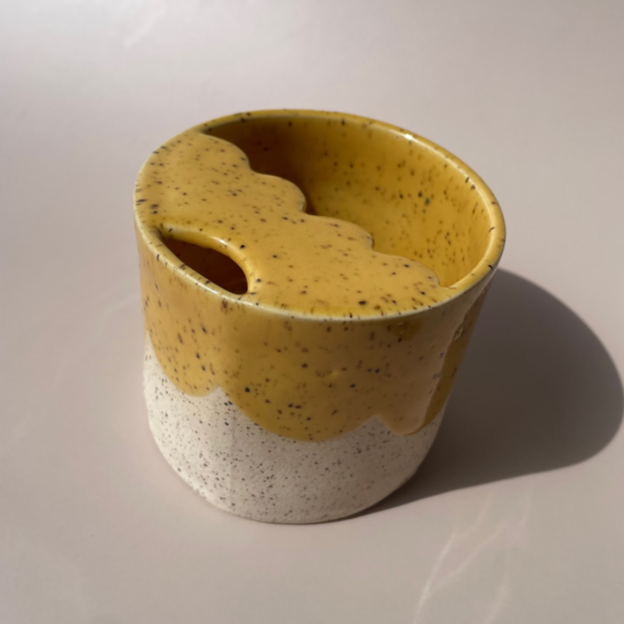 gray travel sipper cup with yellow details