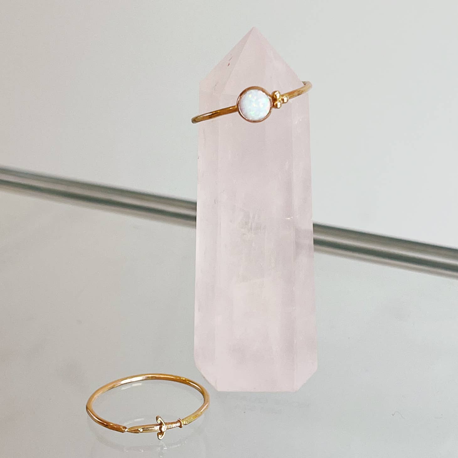 A trio of delicate dots nestles up next to a shimmery opal stone in this ring.   Hand-formed, this ring is set in a bezel style in 14k goldfill.  Available in sizes 4-11 16 Gauge wire thickness 6mm opal and 2 mm round dots Polished finish