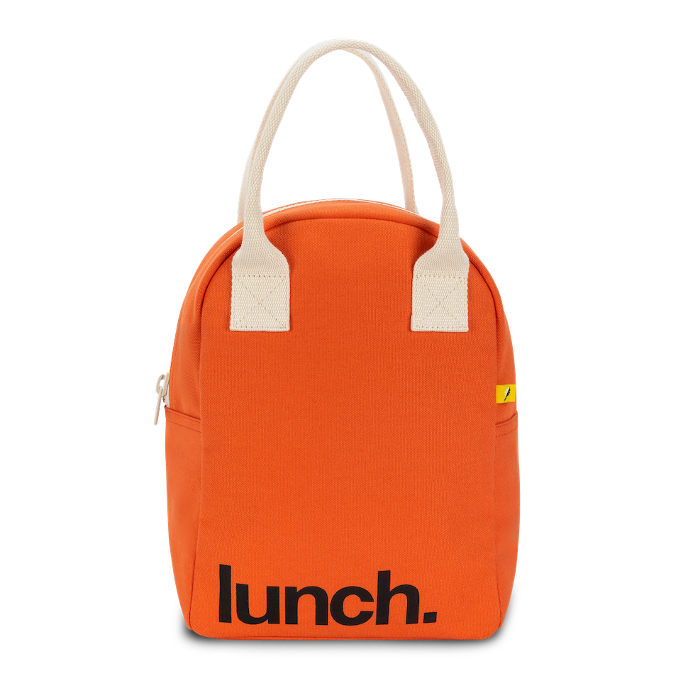 Certified organic cotton. Preshrunk and fully machine washable. Cotton canvas carry handles. Zipper closure. Rinse-able, tested food-safe lining. Interior pocket (for a water bottle or ice pack). Durable and roomy. Lunch bag is lined but not insulated. Water-resistant lining works well with an ice pack, if desired. Color in Poppy Orange