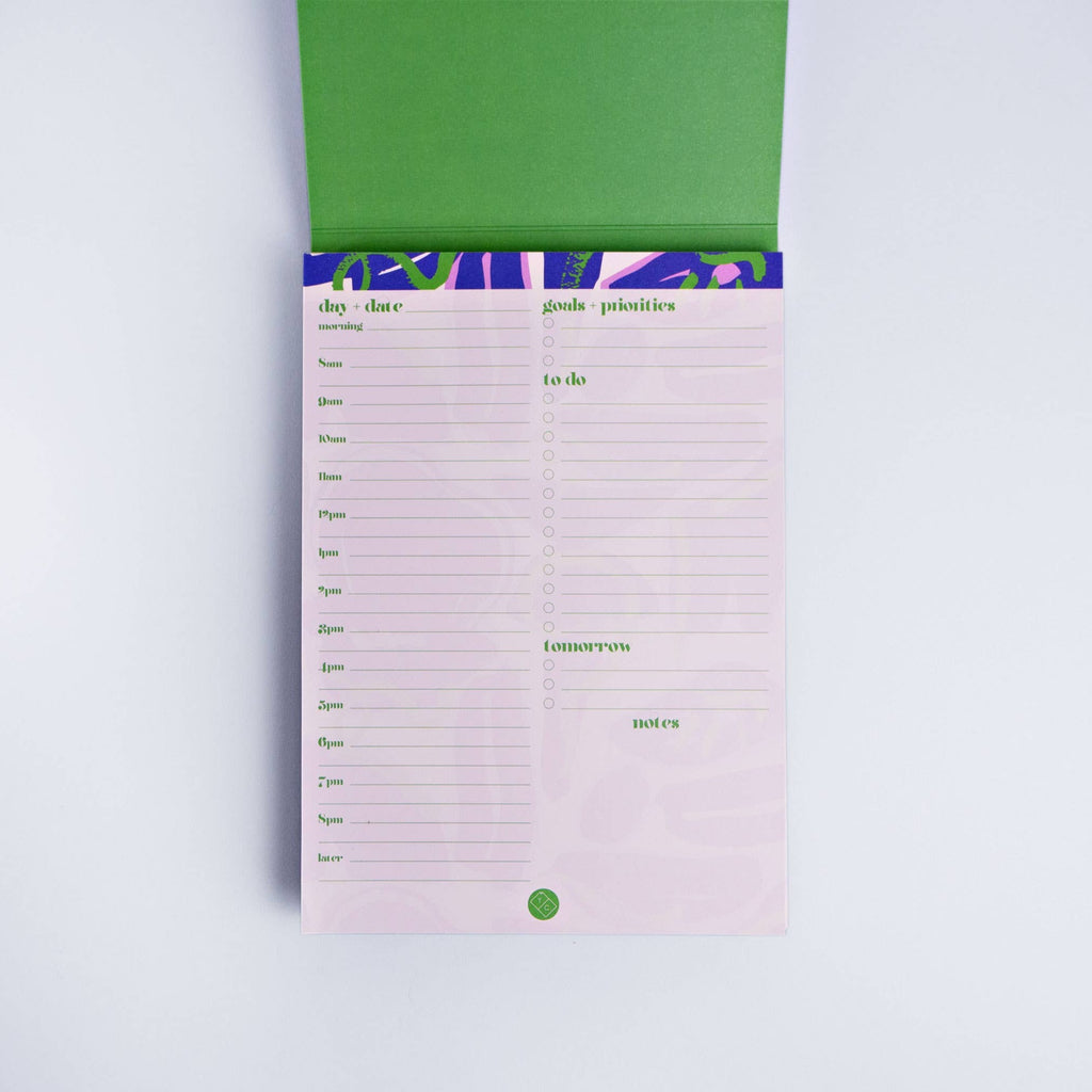 This A5 size (5.83 in x 8.27 in) pad has approx. 50 pages, has a wrap around cover and is printed on FSC certified paper using vegetable inks and has recycled cardboard backing. The pages are 115gsm and the cover is 300gsm, and each page features a weekly planner page on the reverse so you can make the most of your pad. Made in the UK.