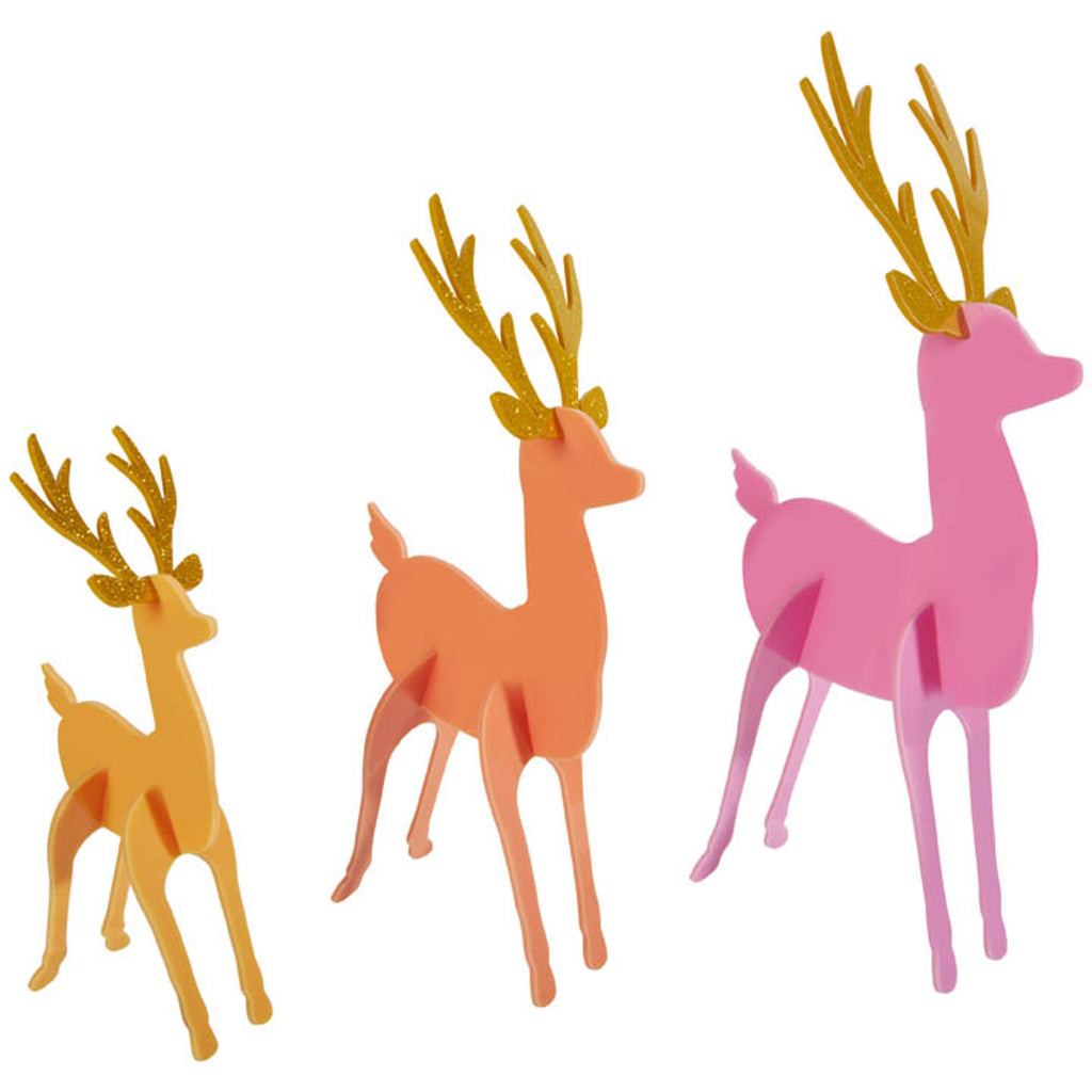 Collect all 3 colorways of these bright & colorful acrylic Christmas Deer! Set includes 3 deer in large, medium, and small sizes with gold glitter acrylic antlers.  Some assembly required Large 14" H x 6" W, Medium 12" H x 5" W, Small 9" H x 4" W Acrylic Deer - Tangerine, Coral, and Pink. Comes in a package all together.