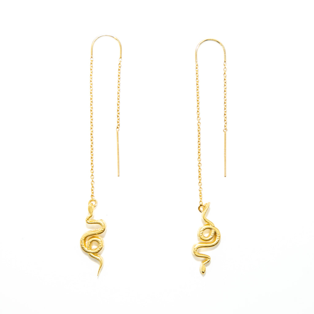 Made by Mineral and Matter in collaboration with Hot Slice Designs.

Historically, serpents and snakes represent fertility or a creative life force. As snakes shed their skin through sloughing, they are symbols of rebirth, transformation, immortality, and healing. These threaders inspire the wearer to welcome renewal in every new seasons of life. Each snake is an original design that has been turned into a model and then cast and plated by our small team.

• Made in 14k gold fill metal chains and 18k gold p