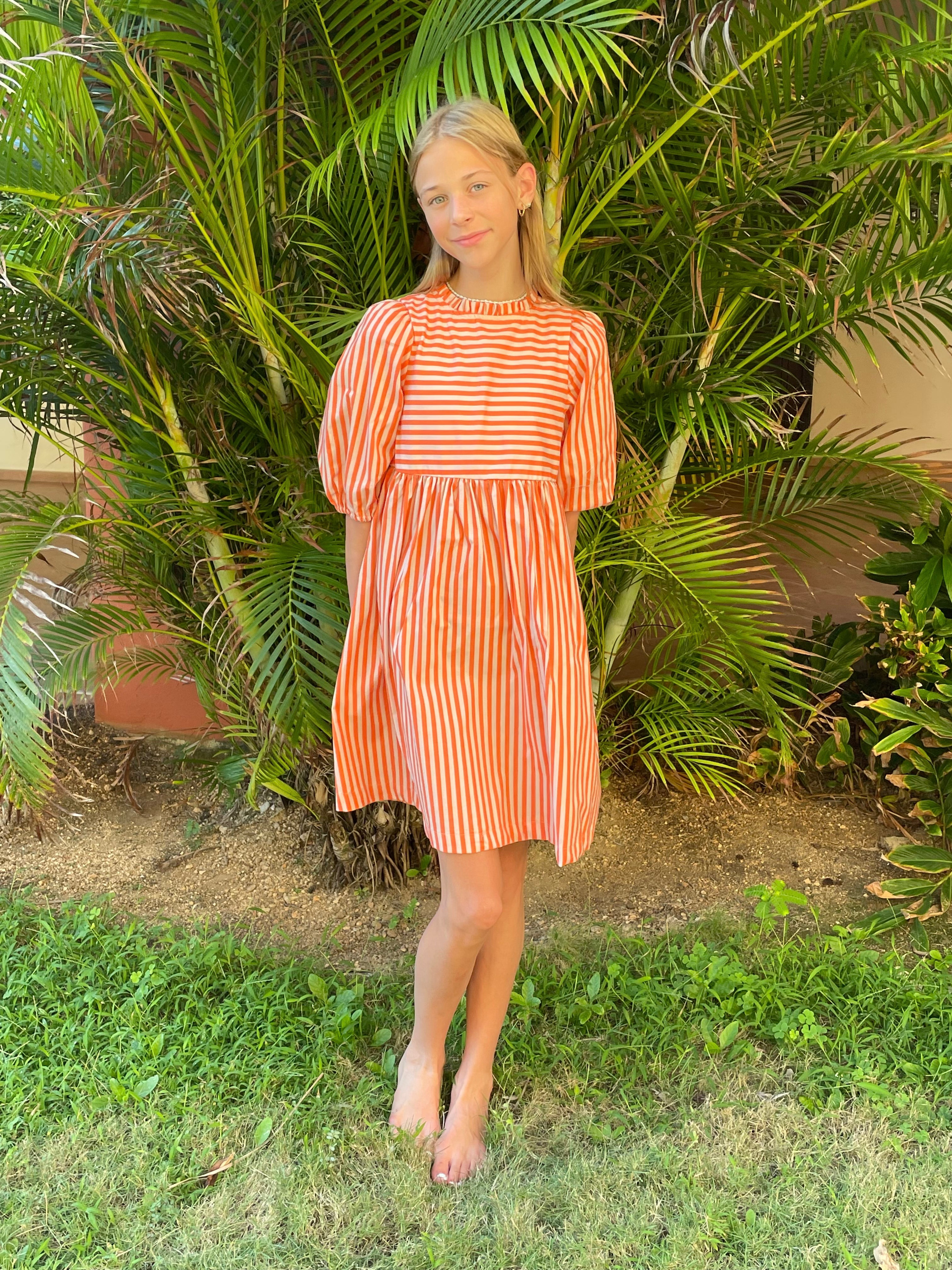 Introducing The Goldie - the perfect blend of colorful style your kids will love. With its vibrant Orange & Pink Stripe design from Rifle Paper Co., your little ones will squeal with joy! So, let their imaginations run wild and give them the gift of style with The Goldie.  Made for play or the ballet these made-in-Utah dresses are small batch, high quality and made to be passed on to generations to come.