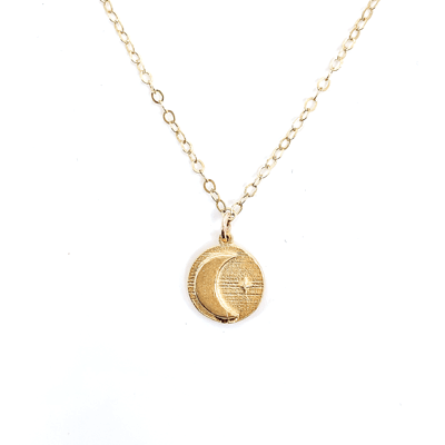 The Astral Collection is four coin necklaces all designed around an interstellar theme. Each coin is a dainty 1/4" size to layer well with other pieces. Coin is 18k gold plated and chain is 16" 14k gold fill.
