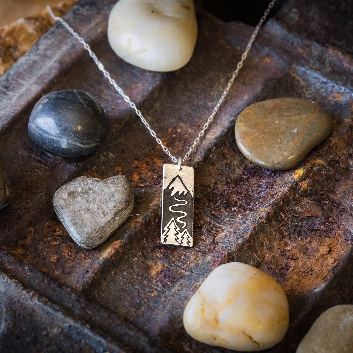 Solid Sterling Silver pendant. Polished finish on the front. Satin finish on the back. Solid Sterling Silver chain.
