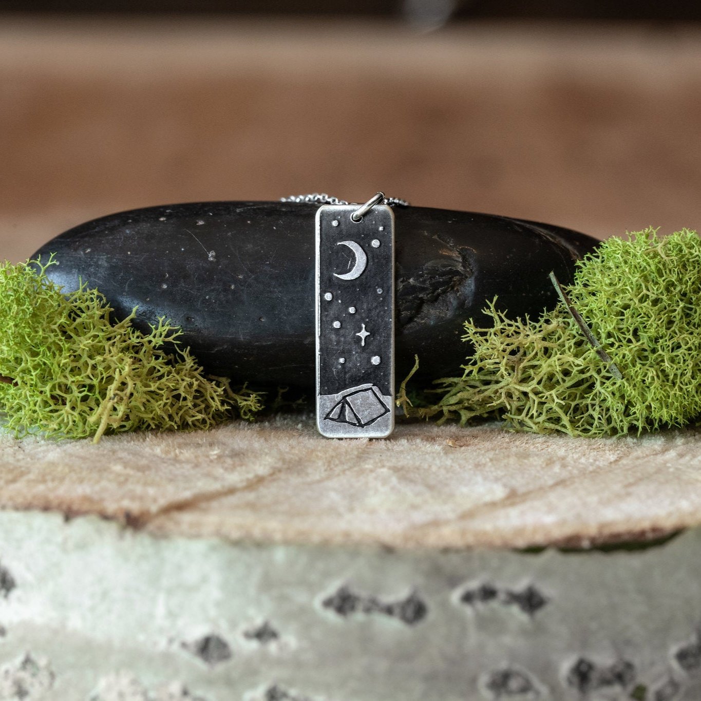 Solid Sterling Silver pendant. Polished finish on the front. Satin finish on the back. Solid Sterling Silver chain.